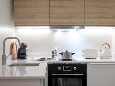 a kitchen with a stove with a pot on it at ´Vicens Gem´ Private terrace HS Wi-Fi in Gracia by MyRentalHost in Barcelona