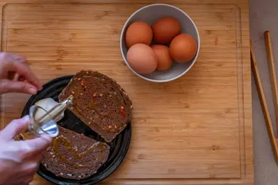 a person is making a loaf of bread and eggs at Verdi 254 in Barcelona