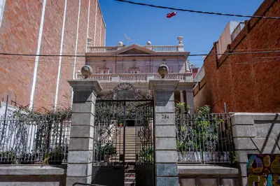 an old house with a gate in front of a building at Verdi 254 in Barcelona