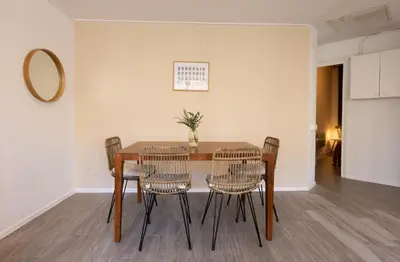 a dining room table with chairs and a mirror at Stay U-nique Apartment Rossello II in Barcelona