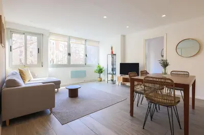 a living room with a table and a couch at Stay U-nique Apartment Rossello II in Barcelona