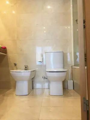 a bathroom with a toilet and a sink at Apartment familiar in Barcelona