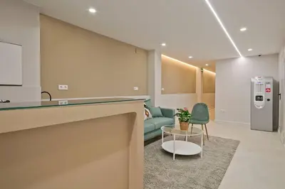a living room with a couch and a table at YOUR HOME- Apartment Camp Nou 2a in Hospitalet de Llobregat