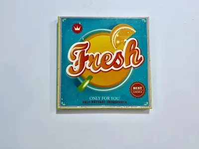 a sign on a wall with an orange drink at Studio Sagrada Familia in Barcelona
