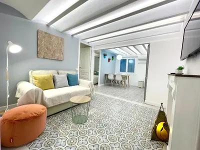 a living room with a couch and a table at Lazy Donkey Sagrada Familia in Barcelona