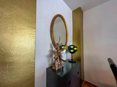 a mirror on top of a dresser in a room at Sira House by Hello Homes Sitges in Sitges