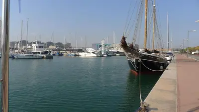 a boat is docked in a marina with other boats at ALEXANDRA´s BEACH-PORT in Badalona