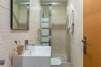 a bathroom with a sink and a toilet and a shower at Canela Homes BARCELONA FLORIDABLANCA in Barcelona