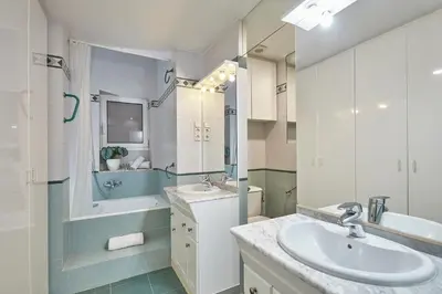 a bathroom with a sink and a tub and a mirror at BBarcelona Gràcia Nova Flat in Barcelona