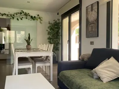 a living room with a couch and a table at Cal Sidru Castellolí in Castellolí