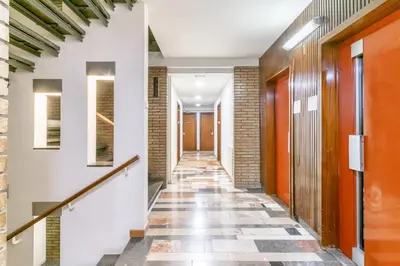 a hallway of a building with a tile floor at Elegance Barcelona Rentals in Barcelona