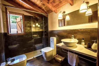 a bathroom with a sink and a toilet at Swiss style villa near Barcelona 10min to beach in Sant Cebrià de Vallalta