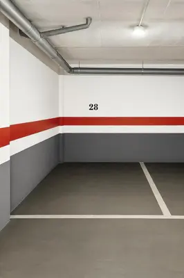 an empty room with a red and white wall at Apartamento Sol Terraza in Montgat