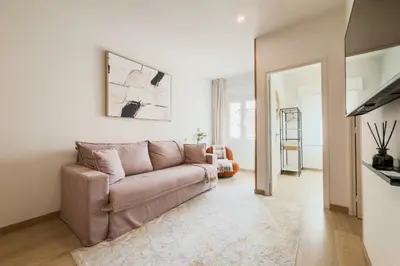 a bathroom with a sink and some baskets at Barcelona Aura Apartments in Hospitalet de Llobregat
