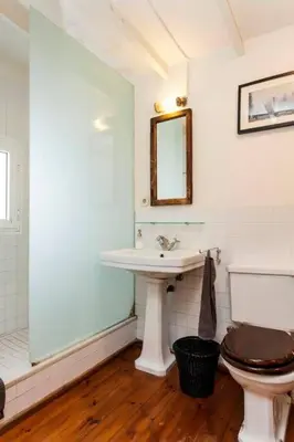 a bathroom with a toilet and a sink at Canela Homes BARCELONA BORN in Barcelona