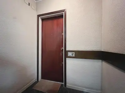 an empty hallway with a door in a room at Stay U-nique Apartment General Mitre in Barcelona