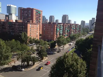 a view of a city street with tall buildings at Apartamento Forum in Barcelona