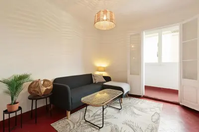 a living room with a couch and a table at Sagrada Familia Vl by Enjoy Apartments in Barcelona