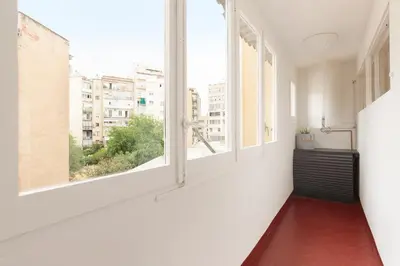 an empty room with an open window with a view at Sagrada Familia Vl by Enjoy Apartments in Barcelona