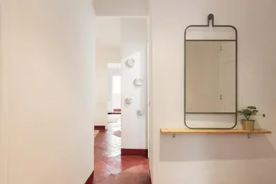 a mirror on a wall in a room at Sagrada Familia Vl by Enjoy Apartments in Barcelona
