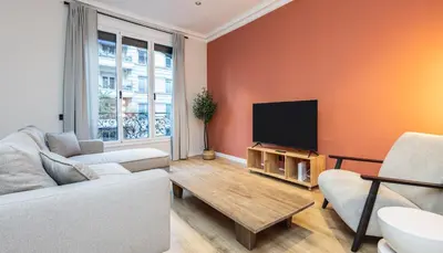 a living room with a couch and a flat screen tv at Stay U-nique Apartments Balmes II in Barcelona