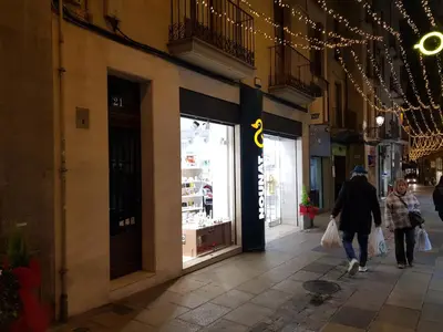 a man and a woman walking down a street at Pis clar i espaiós in Manresa