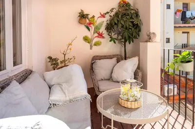 a living room with a couch and a table at Enchanting 2 BR flat with terrace near Plaça Espanya in Barcelona
