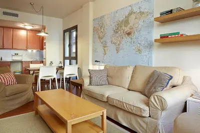 a living room with a couch and a table at Olles Apartment in Barcelona