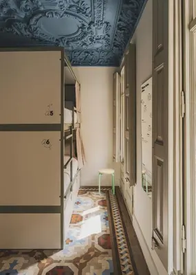 a hallway with a room with bunk beds at Piulet Hostel in Barcelona