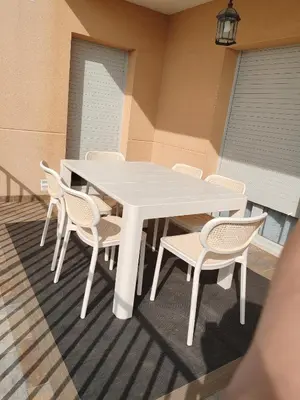 a white table and chairs on a patio at Casa Santa Creu - Private family villa in nature in Piera