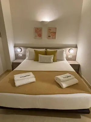 a balcony with a table and chairs and a window at Stay Unique Apartments Pau Claris con piscina in Barcelona