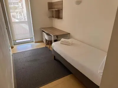 a bathroom with a toilet and a glass shower at Stay Unique Apartments Pau Claris con piscina in Barcelona