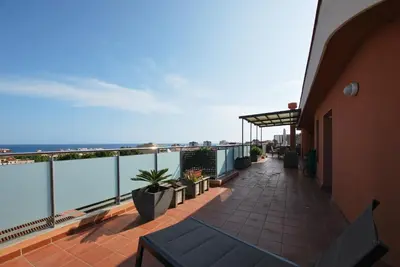 a balcony of a building with a view of the ocean at Picasso Street in Vilassar de Mar
