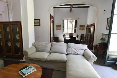 a living room with a couch and a table at Vila d'Alba in Sant Andreu de Llavaneres