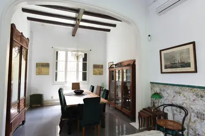 a dining room with a table and chairs at Vila d'Alba in Sant Andreu de Llavaneres