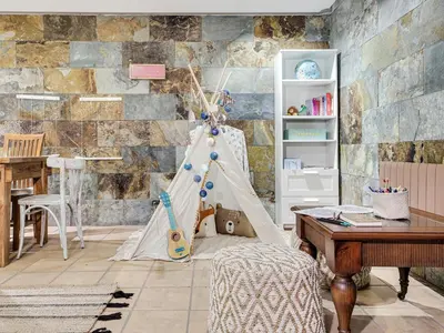 a childrens room with a pretend play tent at Xauxa in Sant Pere de Vilamajor