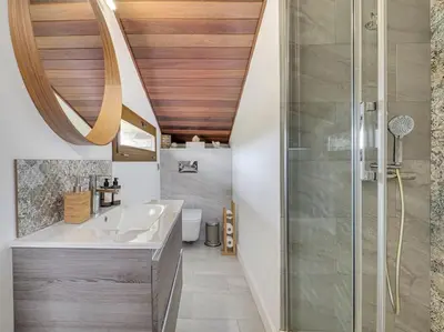 a bathroom with a sink and a shower at Xauxa in Sant Pere de Vilamajor