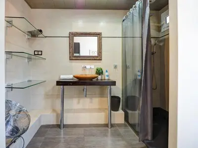 a bathroom with a sink and a shower at Atalaya Apartment by Hello Homes Sitges in Sitges