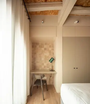 a kitchen and living room with a brick wall at Casa Badajoz in Barcelona