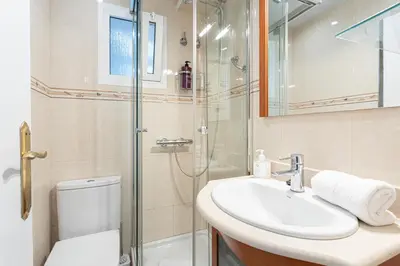 a bathroom with a sink and a shower and a toilet at 3 Bdr Apt In Cornella 5 Mins Form The Metro in Cornellà de Llobregat