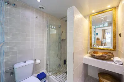 a bathroom with a shower and a toilet and a sink at House 5 Mins From Montgat Beach in Montgat