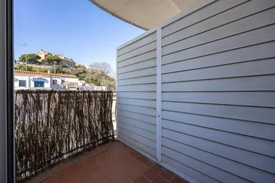 a white fence next to a brick patio at House 5 Mins From Montgat Beach in Montgat