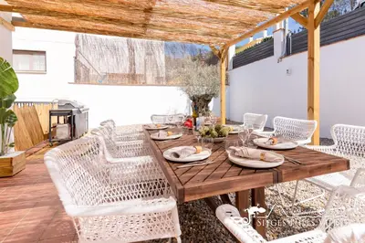a bedroom with a bed and a desk and a window at Villa Serranita - Stylish Holiday Home with Views and Air Conditioning 15 mins to Sitges in Olivella
