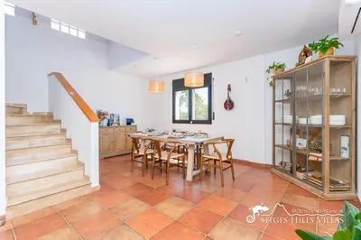a living room with a couch and a table at Villa Serranita - Stylish Holiday Home with Views and Air Conditioning 15 mins to Sitges in Olivella