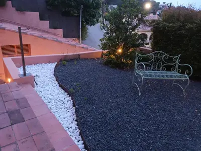a stairway with lights on the side of a building at vistas y relax 126m privados con piscina No cocina in Costa del Maresme