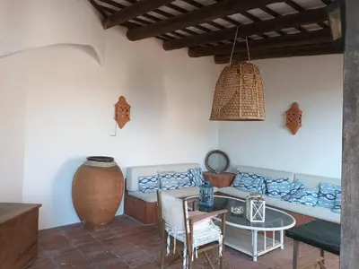 a living room with a couch and a table at vistas y relax 126m privados con piscina No cocina in Costa del Maresme