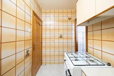 a kitchen with a stove top in a room at Cozy Apt In Cornella 2 Mins From The Metro in La Gabarra