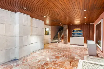 an empty lobby with a staircase and a wine cellar at Big Central Barcelona Flat - 4BR for 7 in Barcelona