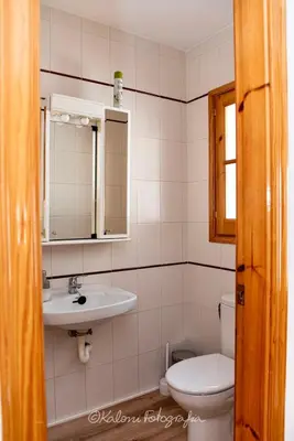 a bathroom with a sink and a toilet at Ca L’Oscana in Bigues i Riells