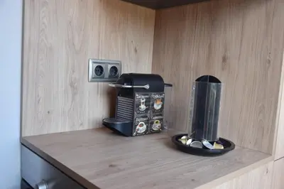 a counter with a coffee maker and a toaster at Apartament Sant Jordi in Sant Joan de Vilatorrada